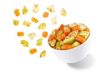 Roasted potato, carrot and zucchini bowl on a white isolated background