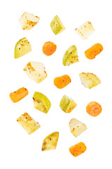 Roasted potato, carrot and zucchini bowl on a white isolated background