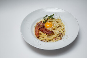 carbonara pasta on a white background