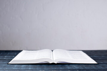 Open Bible. On a wooden table. Holy book, Scripture.