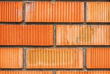 Wall, background, texture of brown, red, orange bricks.