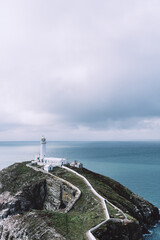 Fototapeta na wymiar South Stack Lighthouse, Wales, Anglesey, UK. It is built on the summit of a small island off the north-west coast of Holy Island. It was built in 1809 to warn ships of the dangerous rocks below.