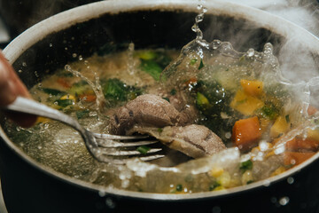Argentinian stew soup called ropa vieja boiled vegetables with ossobuco