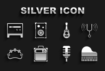 Set Guitar amplifier, Musical tuning fork, Grand piano, Microphone, Tambourine, and Stereo speaker icon. Vector