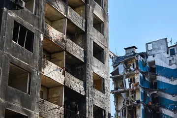 Deurstickers Borodianka, Ukraine, May 28, 2022: Houses destroyed by Russian soldiers © sarymsakov.com