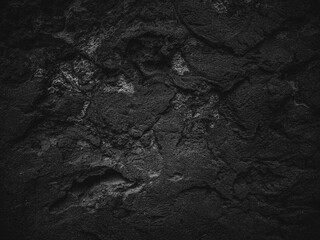 Rock surface with cracks. Black texture. Stone background. Dark marble. Rock texture. Rock pile. Paint spots wall. Grunge Rough structure. Abstract texture.
