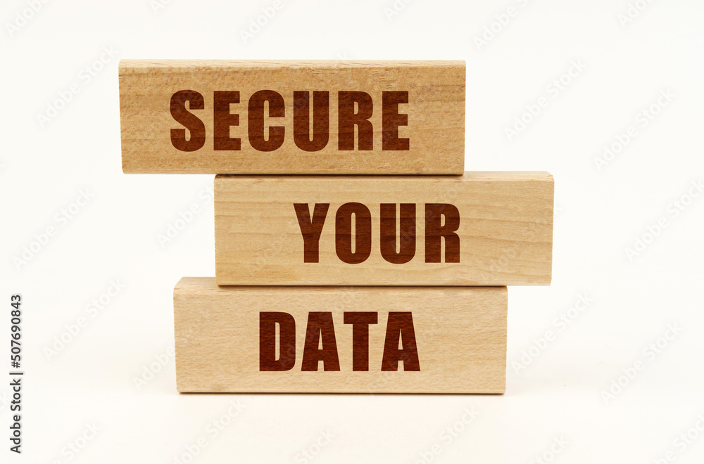 Poster on a white surface are wooden blocks with the inscription - secure your data