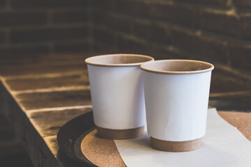 Paper cups on the table in the cafe