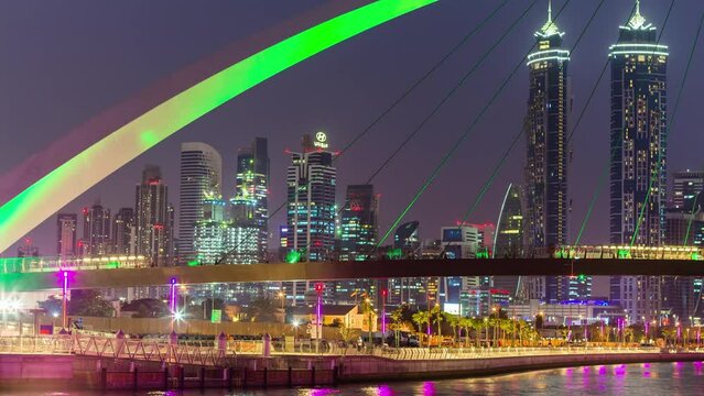 night illuminated dubai water canal famous bridge downtown panorama 4k time lapse uae