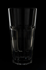 Glass cocktail glass on a black background.
