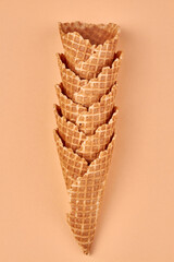 Top view of collection of empty ice-cream cones on color background. Food concept.