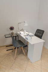 manicure parlour. workplace for a manicurist. The manicure machine is on the table.