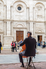 Fototapeta premium Cello player in Pienza Val D'Orcia Tuscany Italy