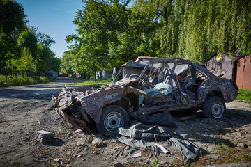 Burnt car of civilians. People were shot by Russian soldiers. May, 2022