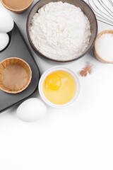 Fototapeta na wymiar Baking ingredients on white background. Food background. Top view 