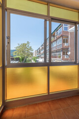 Gazebo with aluminum windows overlooking the city and translucent yellow glass