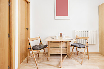 Folding wooden dining table with matching chairs