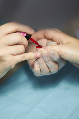 manicurist makes a manicure. The process of creating a quality manicure. Personal care. Beauty industry 
