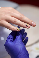 manicurist makes a manicure. The process of creating a quality manicure. Personal care. Beauty industry 

