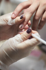 manicurist makes a manicure. The process of creating a quality manicure. Personal care. Beauty industry 
