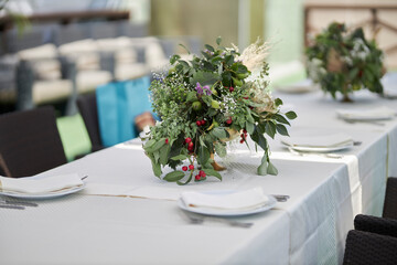 Composition of green dried flowers and wildflowers. Bouquet of green dried flowers and half flowers close up