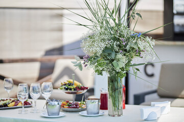 Composition of green dried flowers and wildflowers. Bouquet of green dried flowers and half flowers close up