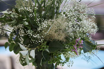 Composition of green dried flowers and wildflowers. Bouquet of green dried flowers and half flowers close up