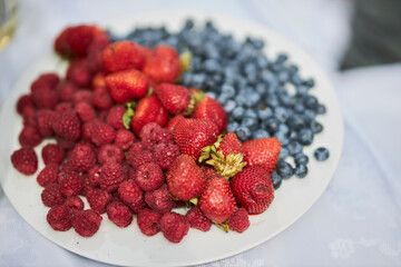 Strawberries and blueberries in a bowl. Berries 