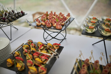 catering. Lots of snacks on stands. Tasty food.