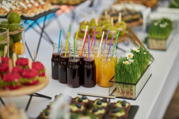 catering. Lots of snacks on stands. Tasty food.