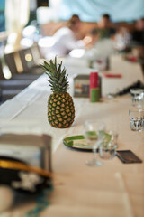 The pineapple is on the table. Fruit