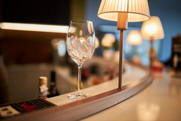 Glass with alcohol. A glass of wine on the table.