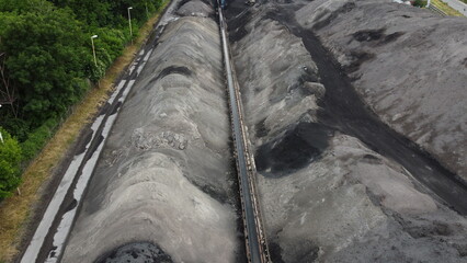 Aerial shot of a large ash dump created by burning a large amount of coal. Located near the city...