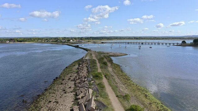 Aerial footage over the old disused Billy Train Line and Train Signal which connected Hayling Island to the mainland over Langstone Harbour.