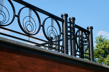 Metal fence on the city environment on a sunny day
