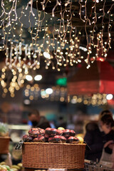 The garland in the supermarket decorates the store. The shop is decorated with lanterns.