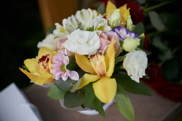 beautiful bouquet of light fresh spring flowers, on a blurred background, close-up