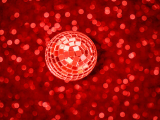 Mirrored disco ball on a red background with bokeh. Mirror Ball Party