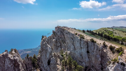 Fototapeta na wymiar flight over suspension bridges at the peak of ai petri mountain in Crimea.
