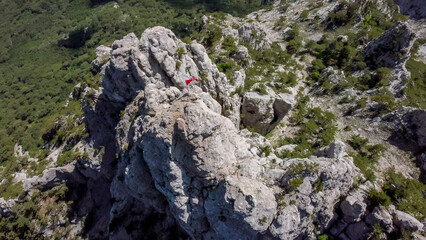  flight over  the peak of ai petri mountain with red flag  in Crimea.