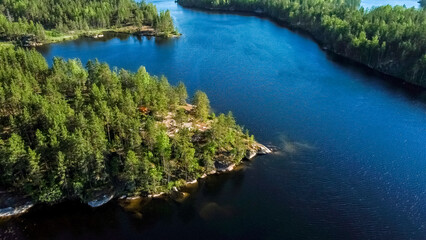 Obraz premium Flight over lakes and forests in Karelia near the village of Kuznechnoye in Russia.