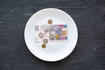 Money spend on food concept on black backgorund.
