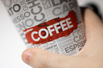 Cartoon coffee cup in hand