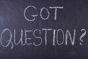 Got question handwritten inscription with white chalk on black chalkboard. Meaning do you have any questions. - Powered by Adobe