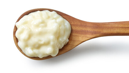 rice pudding in wooden spoon