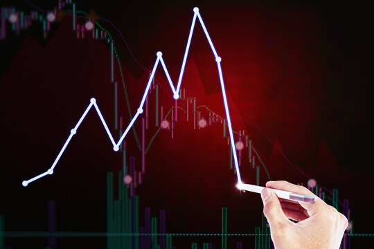 Businessman drawing a sharply declining finance