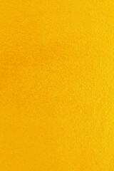 Obraz premium Gold or yellow paint on cement wall texture background.