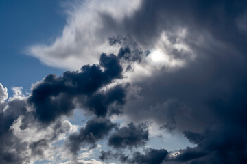 Fototapeta na wymiar Cloudscape with very bright and very dark clouds