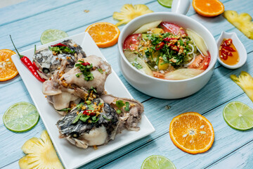 Vietnamese family food. Sour soup bowl of snakehead fish is rich in Vietnamese culinary identity