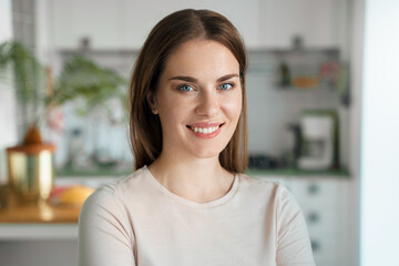 Portrait of young smiling woman at home office
